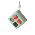 Green yoto mini sleve and yoto mini with orange buttons on a white background