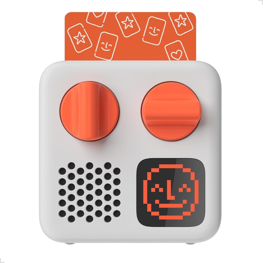 White electronic YOTO reader with orange buttons and a pixelated face on an orange card with star designs