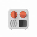 Small white Yoto Mini device with orange buttons and a black square on a white background