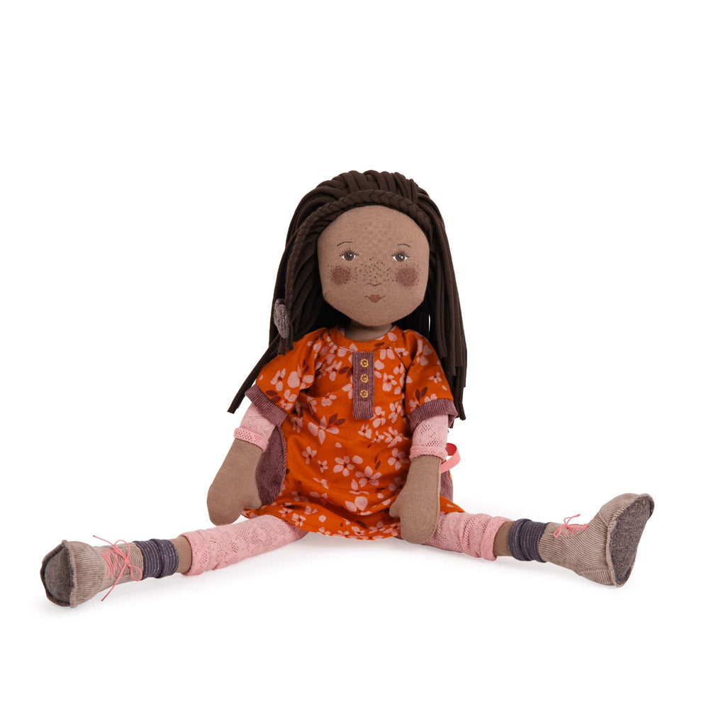 Doll with braided hair wearing an orange dress on a white background