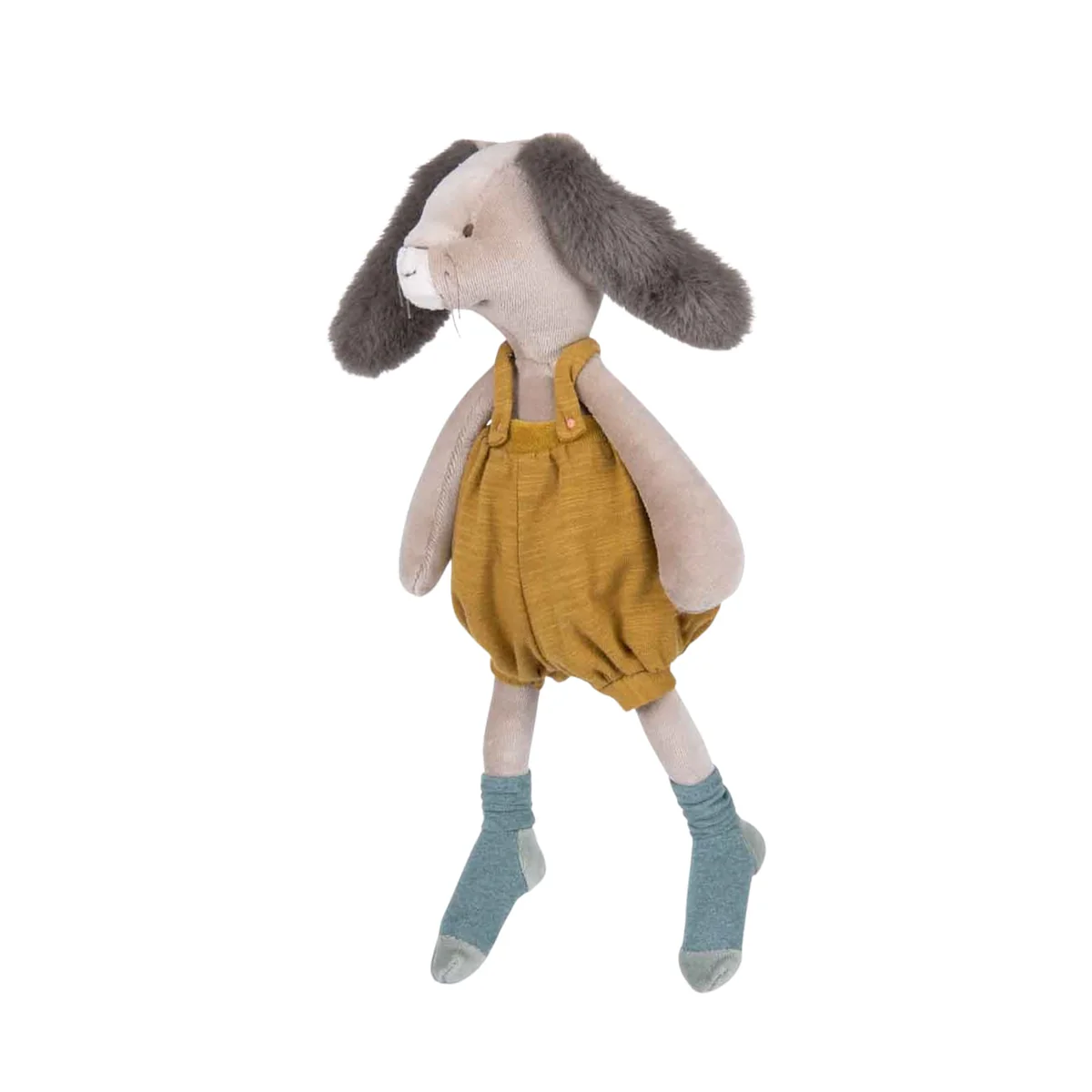 Stuffed animal rabbit wearing mustard yellow overalls on a white background