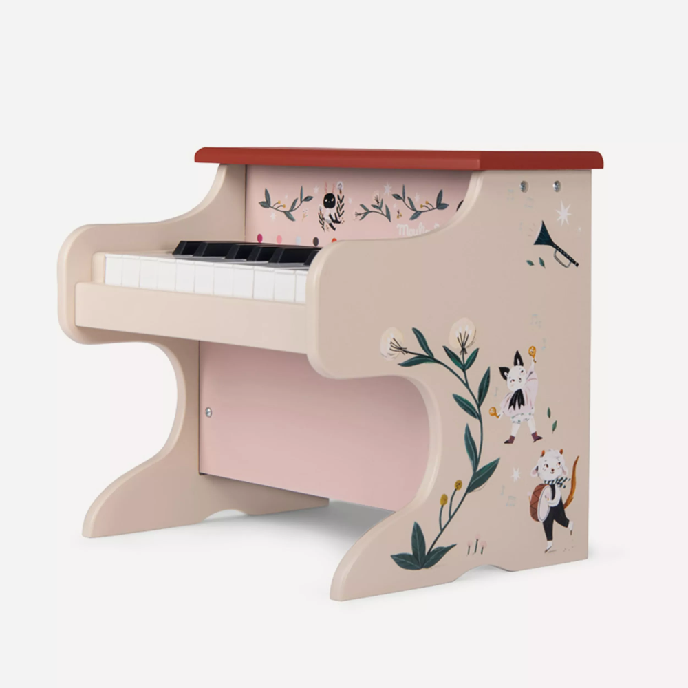 Children's toy piano with floral and animal design on a white background