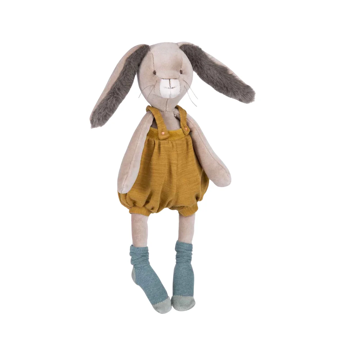 Stuffed bunny toy wearing mustard yellow overalls and blue socks on a white background