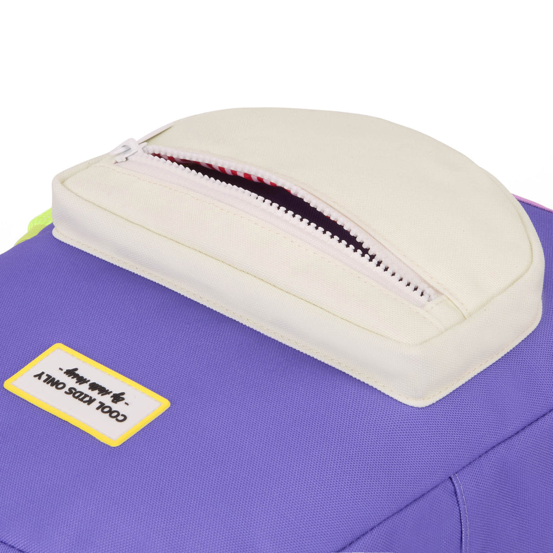 Purple bag with a beige cushion and zipper, featuring a label on a white background