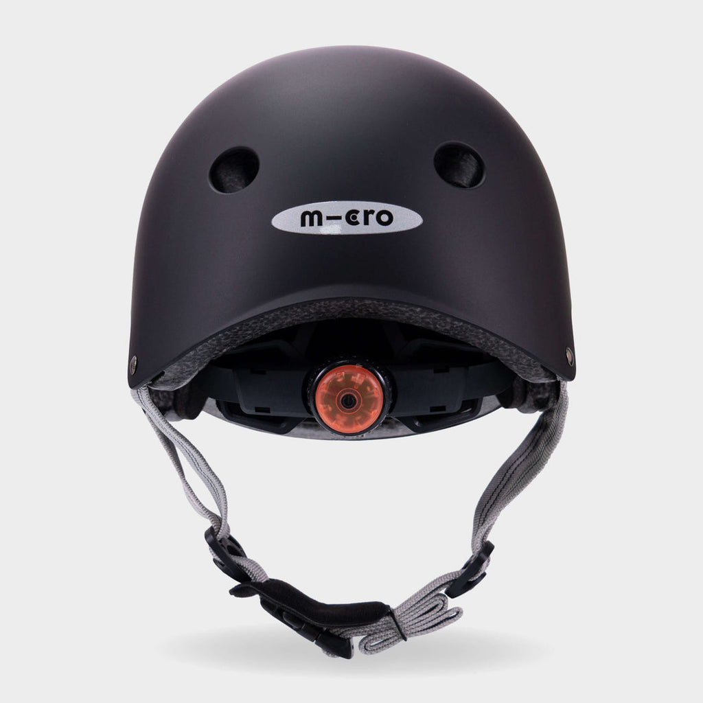 Back of the black Micro plain helmet showing the rear light and micro logo