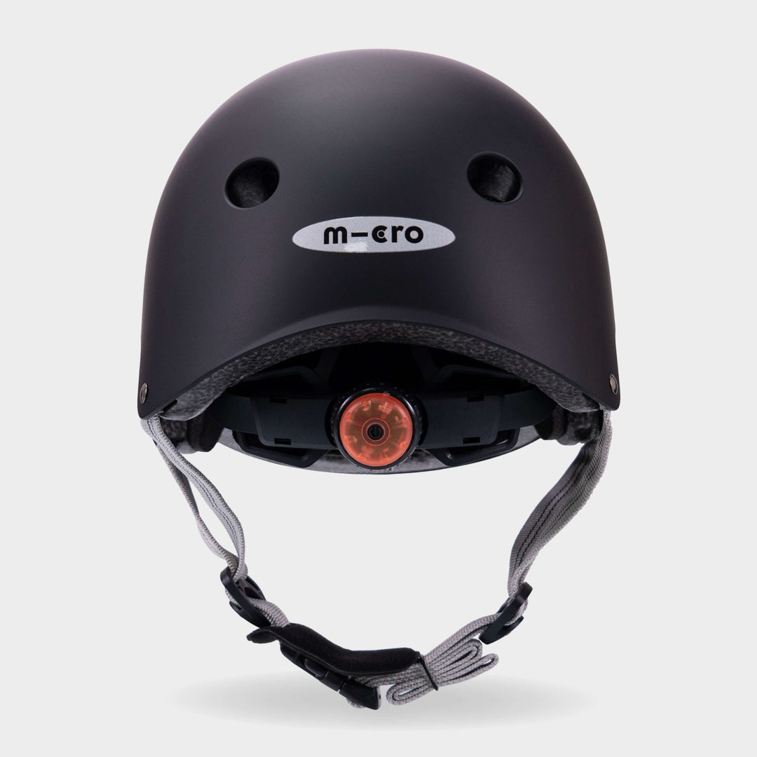 Back of the black Micro plain helmet showing the rear light and micro logo