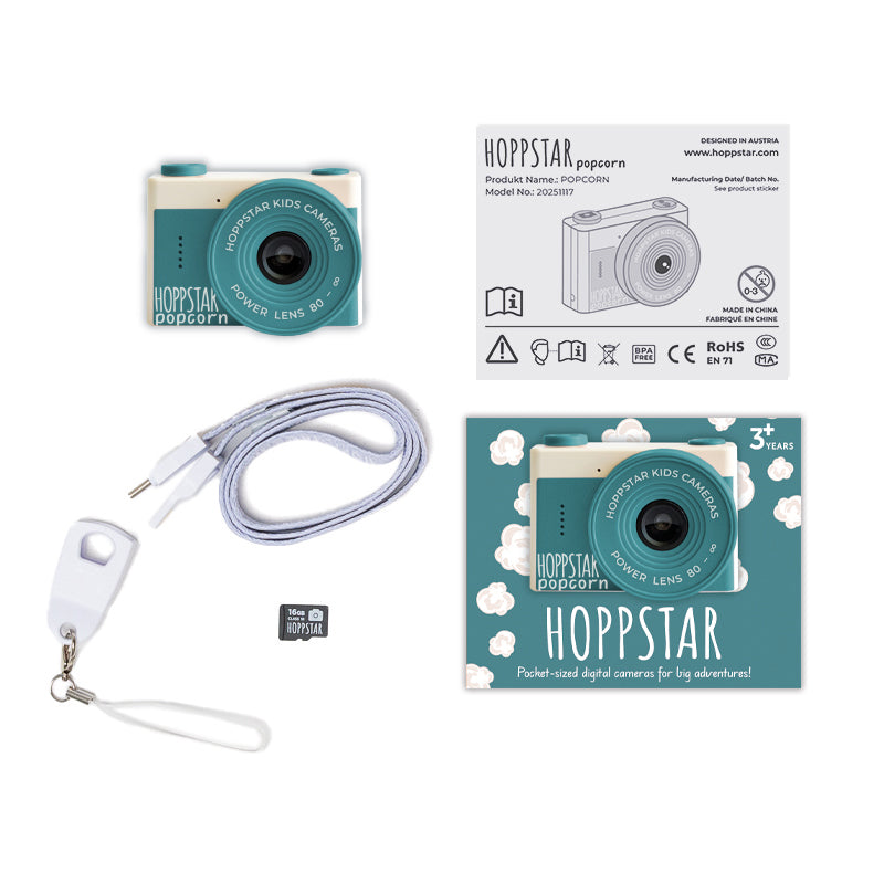 Hoppstar popcorn kids camera with packaging, lanyard, and USB cable on a white background