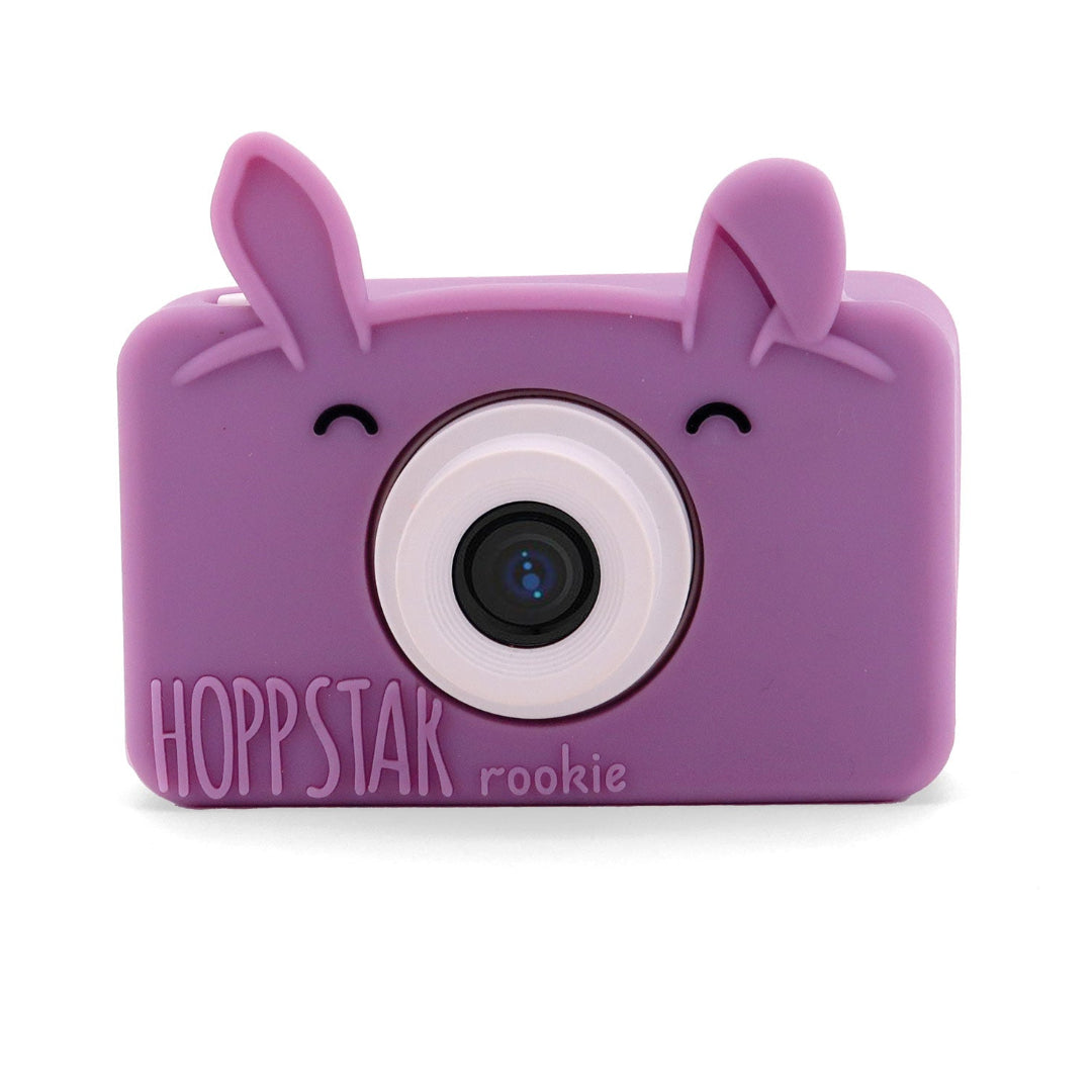 Purple toy camera with animal ears on a white background